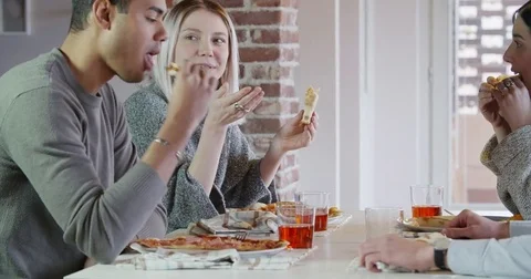 Multiethnic group of friends people enjoy having lunch or dinner meal together Stock Footage