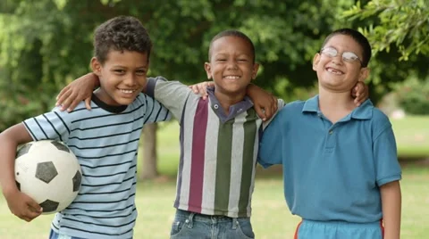 Multiethnic group of happy male friends with soccer ball Stock Footage