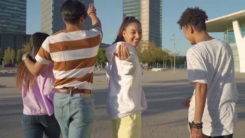 Multiethnic group inviting to the camera to walk with them. Stock-Footage 164778000