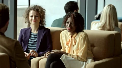 Multiethnic group of people chatting at a cafe. Stock Footage 61158055