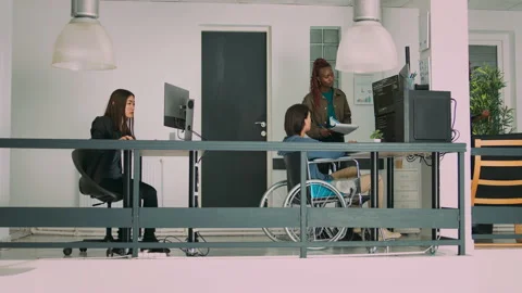 Multiethnic group of programmers collaborating on it project to create algorithm Stock Footage 217409954