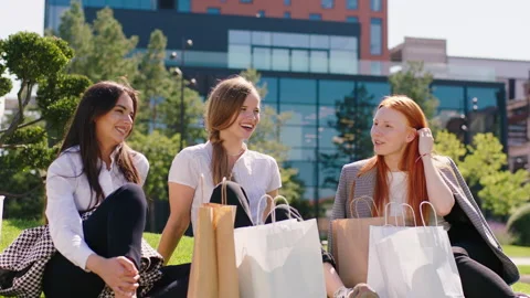Multiethnic group of students after college classes take a sit down on the grass Stock Footage 164864084