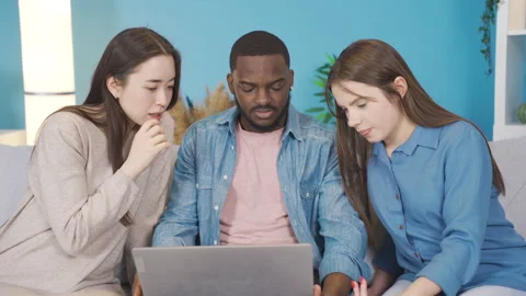 Multiethnic group working on laptop at home. Video stock 228802887