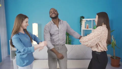 Multiethnic group of young friends dancing at home. Video stock 228805212