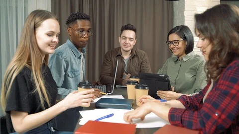 Multiethnic group of young people discussing start-up idea. Stock Footage 125613428