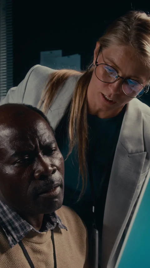 Multiethnic IT Specialists Discussing Bug in Programming Code Stock Footage 289680297