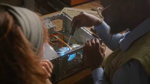 Multiethnic IT Specialists Upgrading Desktop Computer Hardware Stock Footage 341427964