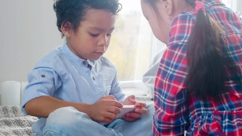 Multiethnic Kids Playing on Smartphone on Bed Video stock 101038887