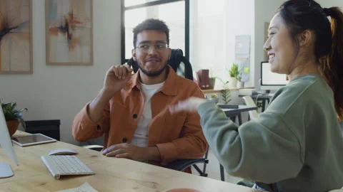 Multiethnic Male and Female Programmers Giving High Fives on Project Completion Stock Footage 293169418