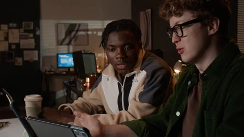 Multiethnic Male Programmers Discussing Software Project on Tablet Stock-Footage 336711455