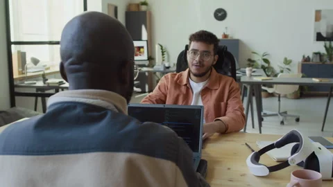 Multiethnic Male Programmers Testing Software and Bumping Fists at Success Stock Footage 293172229
