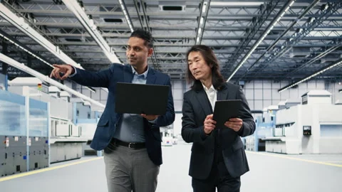 Multiethnic manager in semiconductor factory working together Stock Footage 333392566