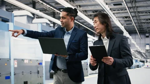 Multiethnic manager in semiconductor factory working together Stock Footage 333394914