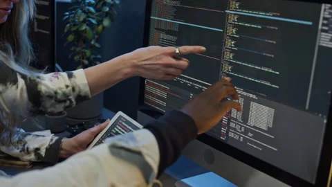 Multiethnic Mobile App Developers Discussing Problem with Code Stock Footage 273828432