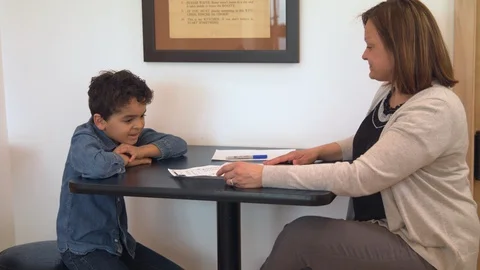 Multiethnic mother and son doing homework 5 Stock Footage 89355732