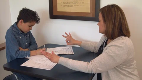 Multiethnic mother and son doing homework 1 Stock Footage 89358424