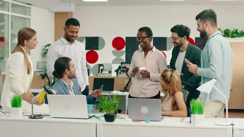Multiethnic office workers and managers in a large office centre have a Stock Footage 166905853