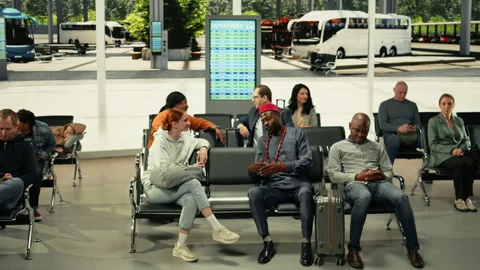 Multiethnic people in crowded bus station hub ready for intercity travel Stock Footage 334725562
