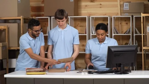 Multiethnic Post Office Clerks Registering Mail Together Stock Footage 114212648