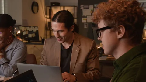 Multiethnic Programmers Collaborating on Code in Office Stock-Footage 336711225