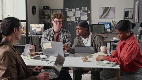 Multiethnic Programmers Collaborating on Software Development in Office Stock-Footage 336715653