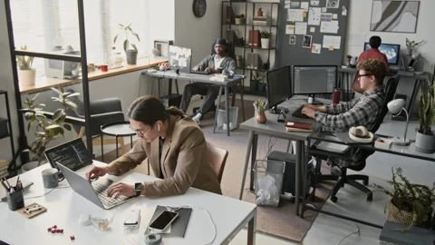 Multiethnic Programmers Developing Software on Laptops in Office Stock-Footage 336713987