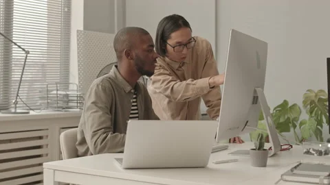 Multiethnic Programmers Working in Team Stock Footage 165720127