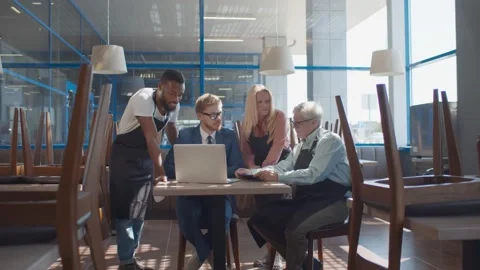 Multiethnic restaurant team using laptop ordering food supply online Stock Footage 135228749