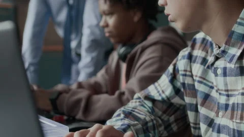 Multiethnic Schoolboys Studying Programming in Class Stock Footage 284433095