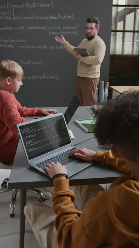 Multiethnic Schoolboys Working on Computer Script on Laptops at Lesson Stock Footage 318719720