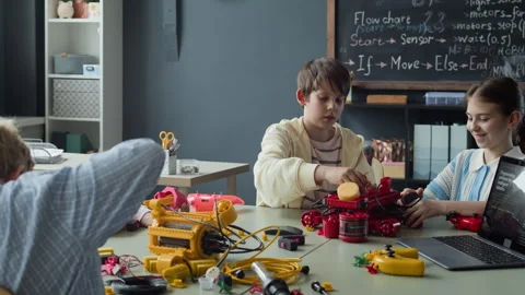 Multiethnic Schoolchildren Building Robots in Stem Lesson Stock Footage 339201655