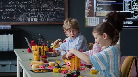 Multiethnic Schoolchildren Building Robots in Stem Class Stock Footage 339206287