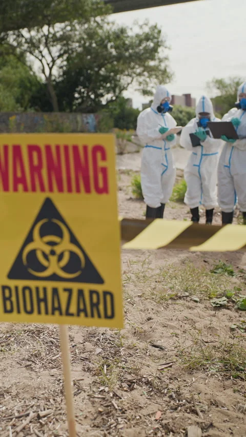 Multiethnic Scientists in Hazmat Suits Investigating Biohazard Site Stock-Footage 344719264