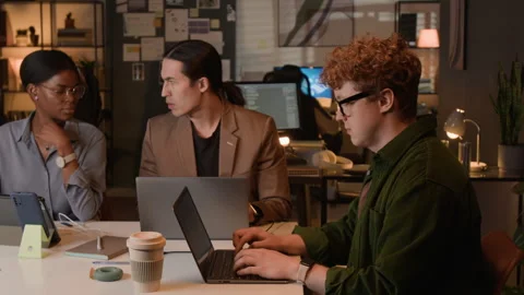 Multiethnic Software Developers Working on Laptops in Office Stock Footage 336716935