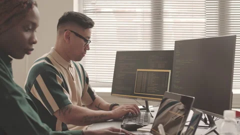 Multiethnic Software Developers Writing Program Codes Stock Footage 195978889