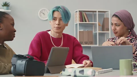 Multiethnic Software Engineers Chatting at Workplace Stock Footage 241263930