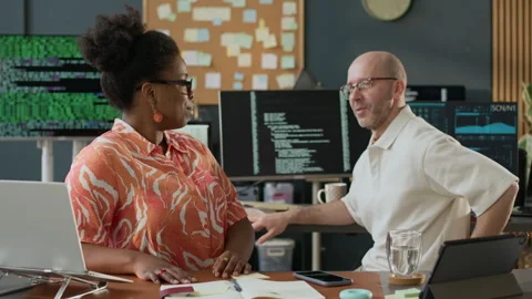 Multiethnic Software Engineers Discussing Work in Modern Open Space Office Stock Footage 306843689