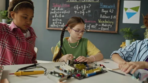 Multiethnic Students Assembling Electronic Circuit Boards in Stem Class Stock Footage 340550235
