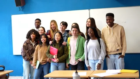Multiethnic students posing together in classroom Stock Footage 302818980