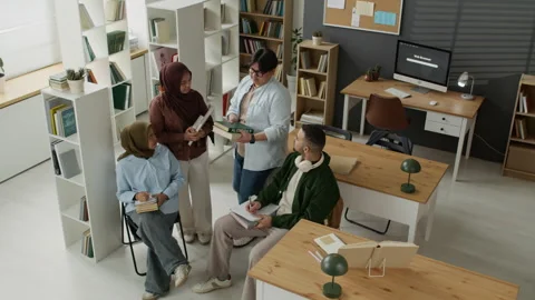 Multiethnic Students Studying Books in Library Classroom Stock Footage 337487436