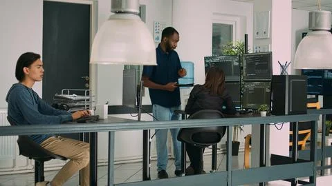 Multiethnic team of app developers collaborating on group project 스톡 사진