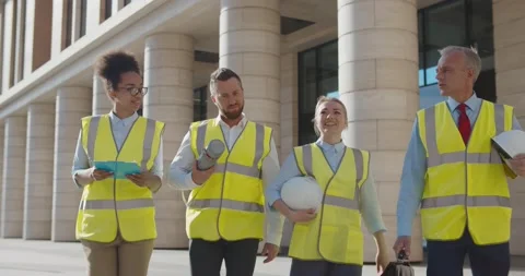 Multiethnic team of diverse engineers inspecting new office building Stock Footage 156447514