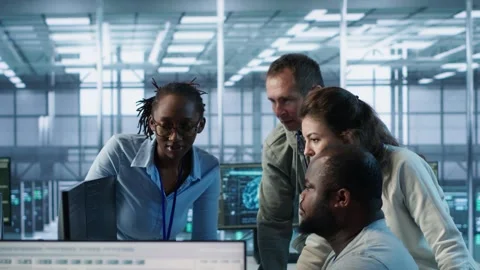Multiethnic team of engineers working in high tech server hub, Stock Footage 319250583