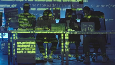 Multiethnic Team of Programmers Coworking at Night Stock Footage 165727536