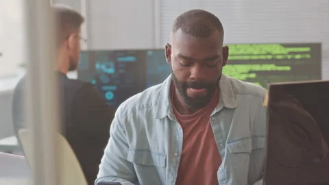 Multiethnic Team of Programmers Working in Office Stock Footage 224064233