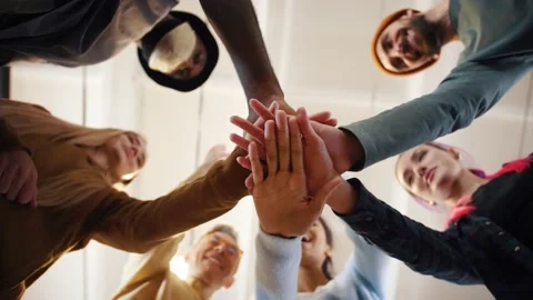 Multiethnic team putting hands together one by one, connection, teambuilding and 库存影片 141535350