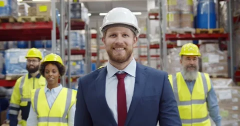 Multiethnic team of warehouse workers smiling at camera Stock Footage 151398416