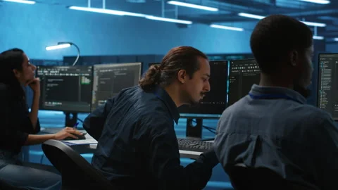 Multiethnic team working together, doing programming in high tech workspace Stock Footage 276194543