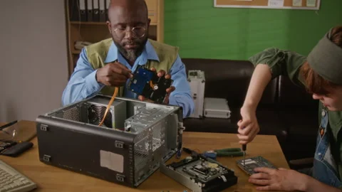 Multiethnic Technicians Assembling Desktop Computer Hardware Stock Footage 341430775