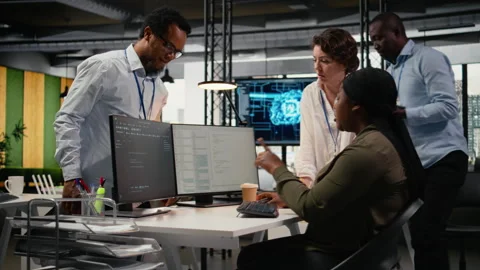 Multiethnic technicians in startup office work with artificial intelligence Stock Footage 323332769